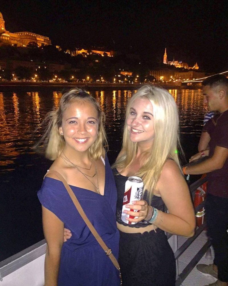 the author and her friend on a party boat in budapest