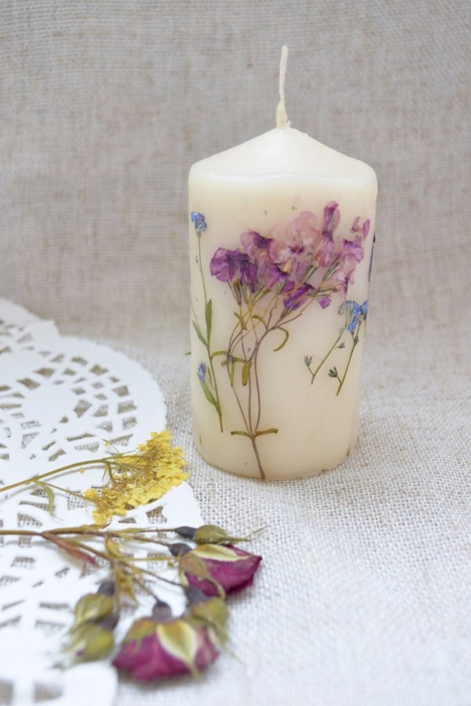 handmade candle with dried flowers