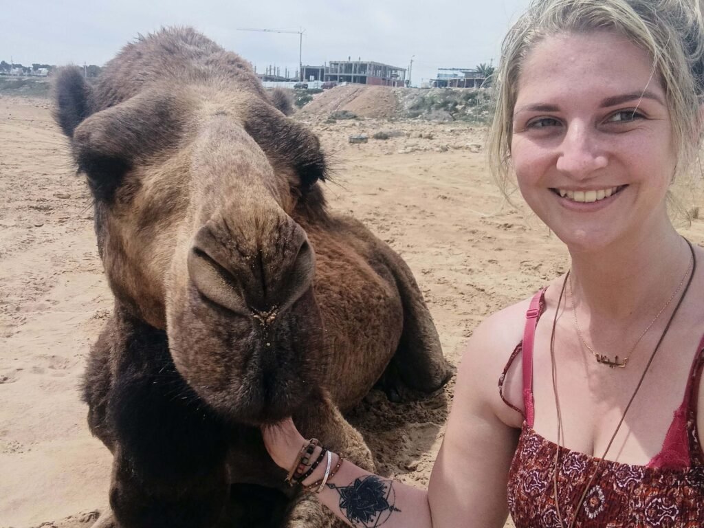 dani taking a selfie with a camel