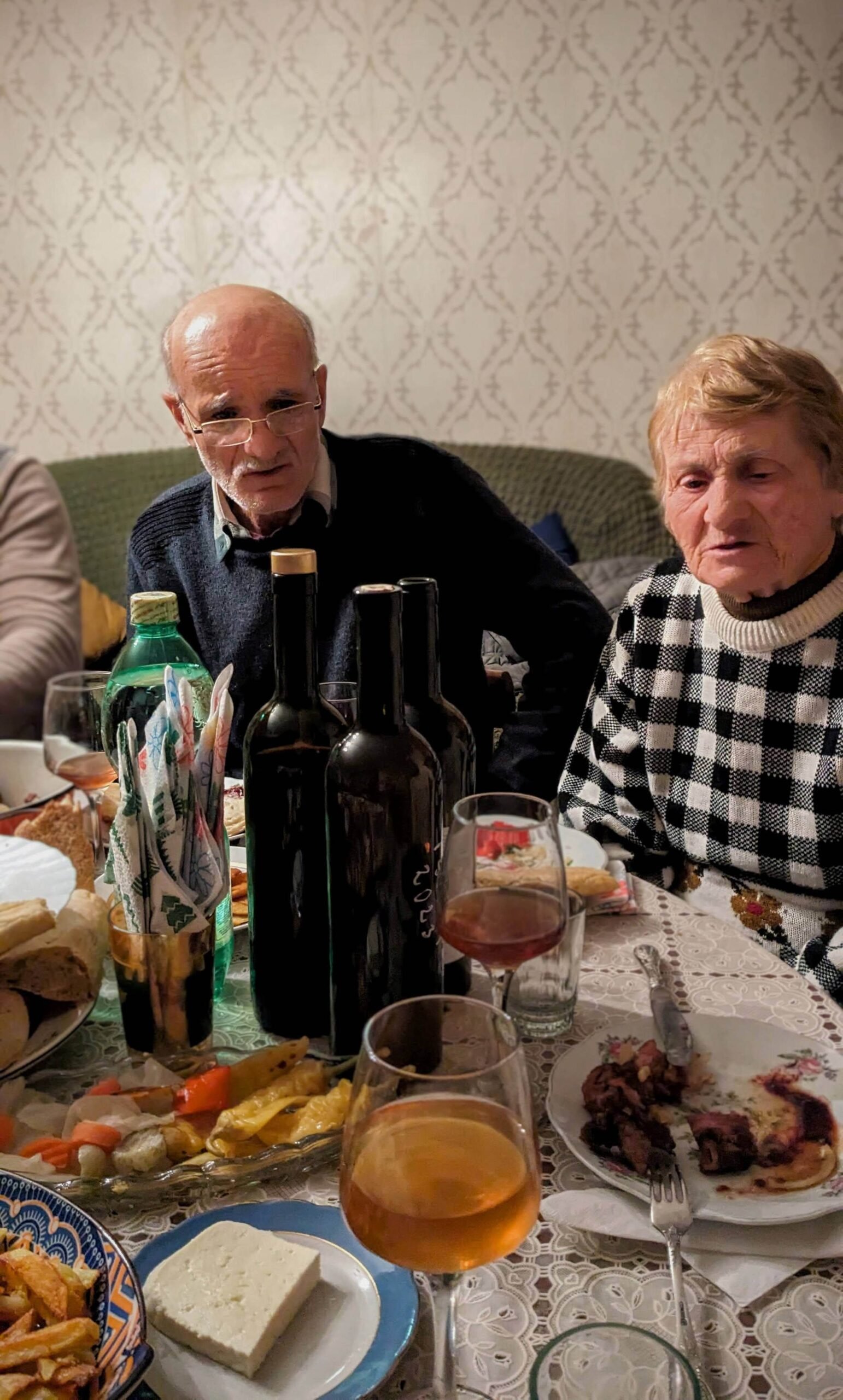 elderly georgians at the dinner table singing