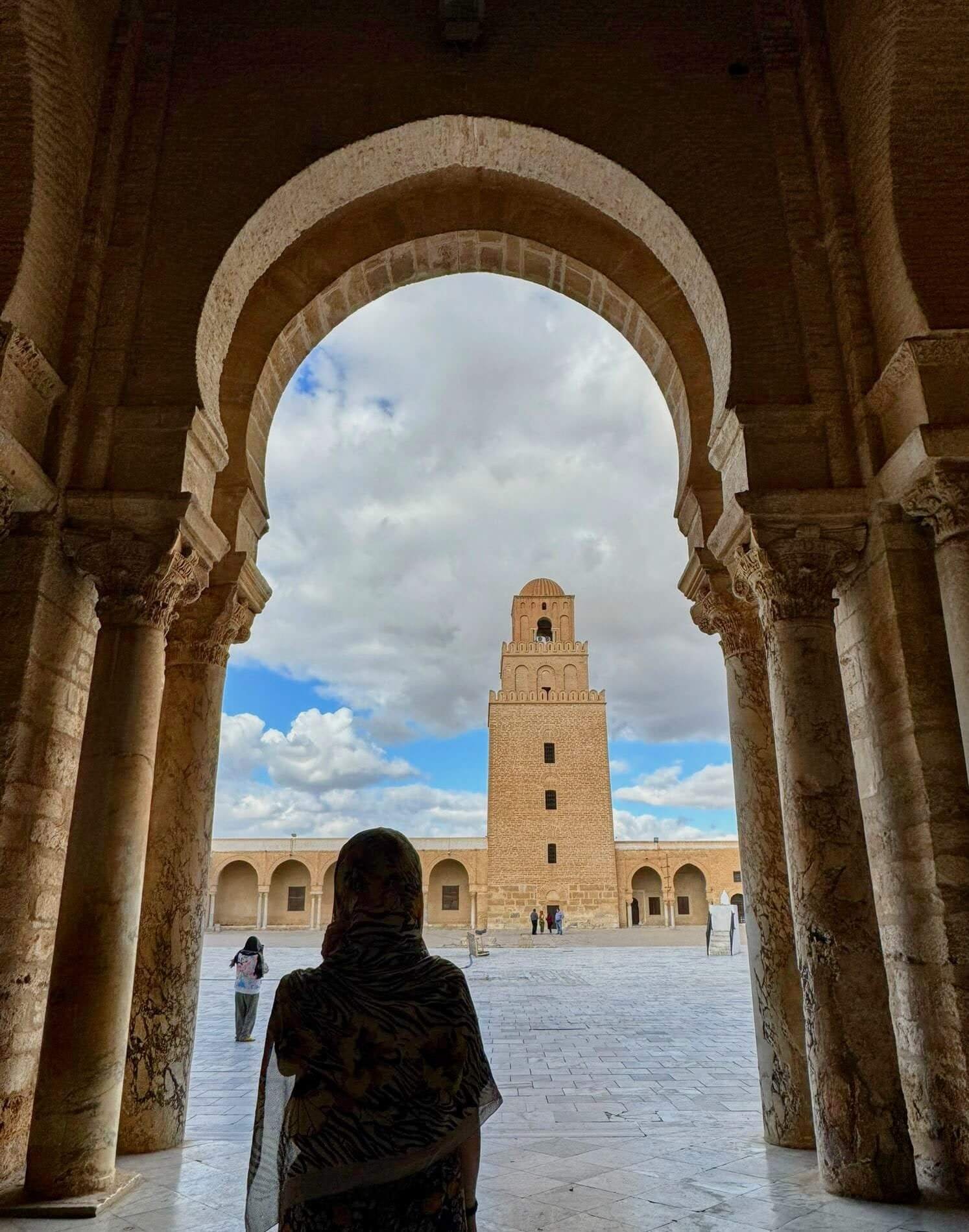 the author looking at the grand mosque of kairouan, tunisia