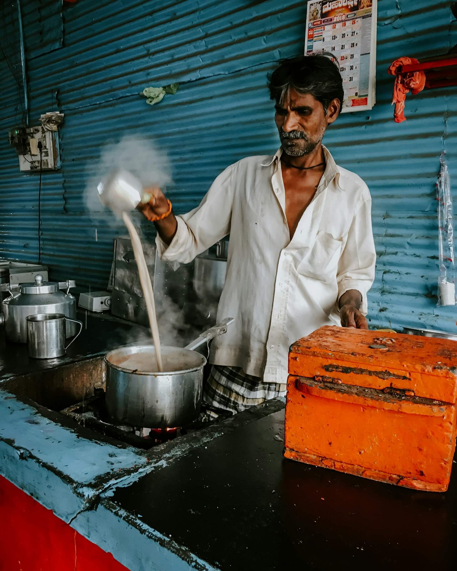 an indian man cooking