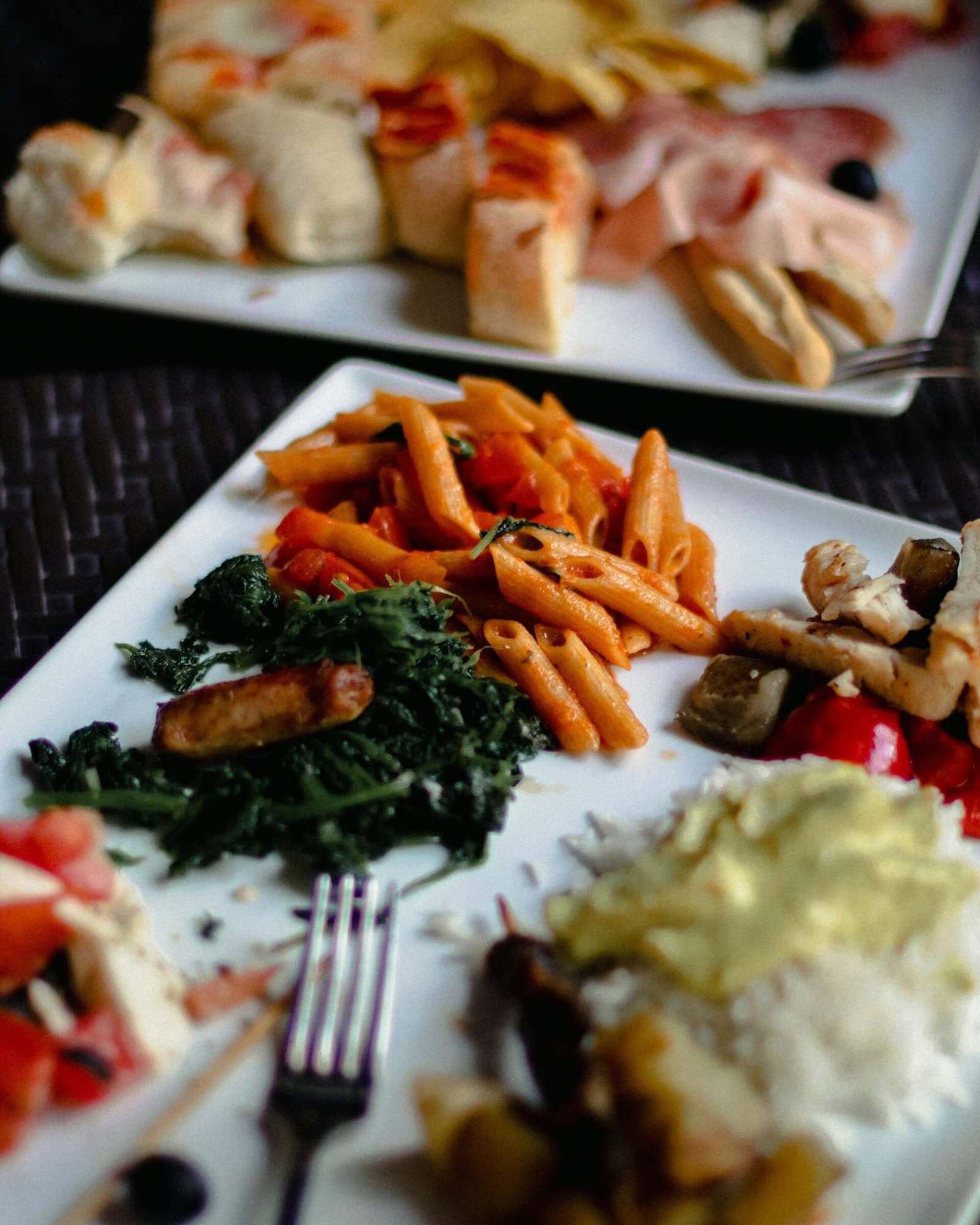 a plate with various things on it, including pasta