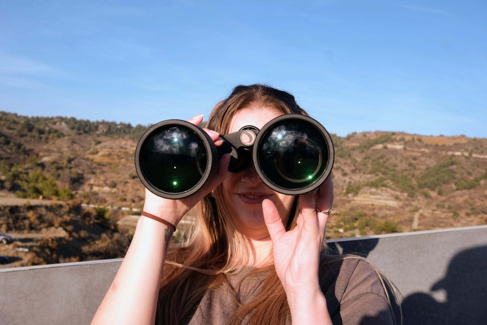 dani with a pair of binoculars