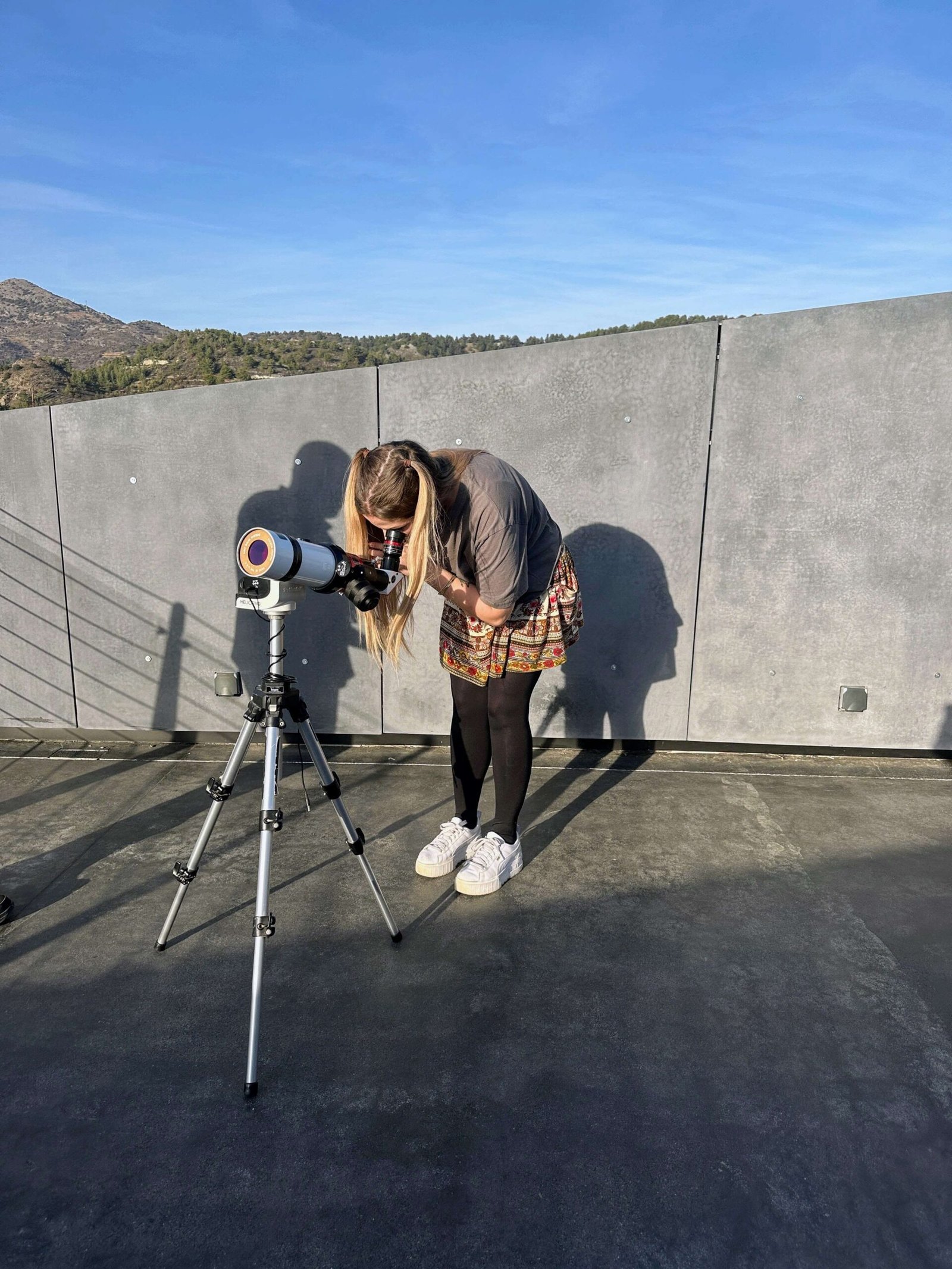 dani looking through a telescope