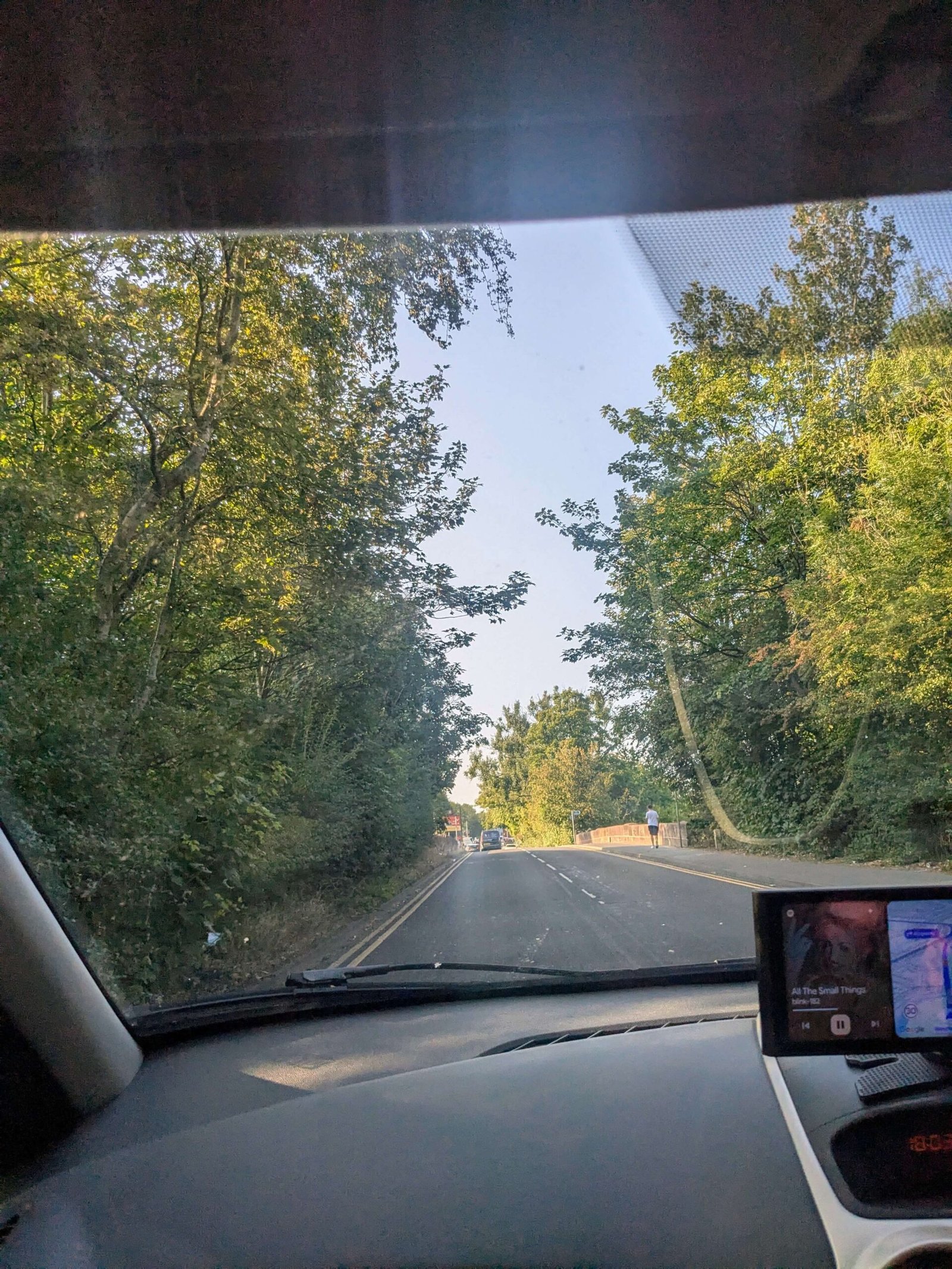 a photo taken of the road from the passenger seat of a car