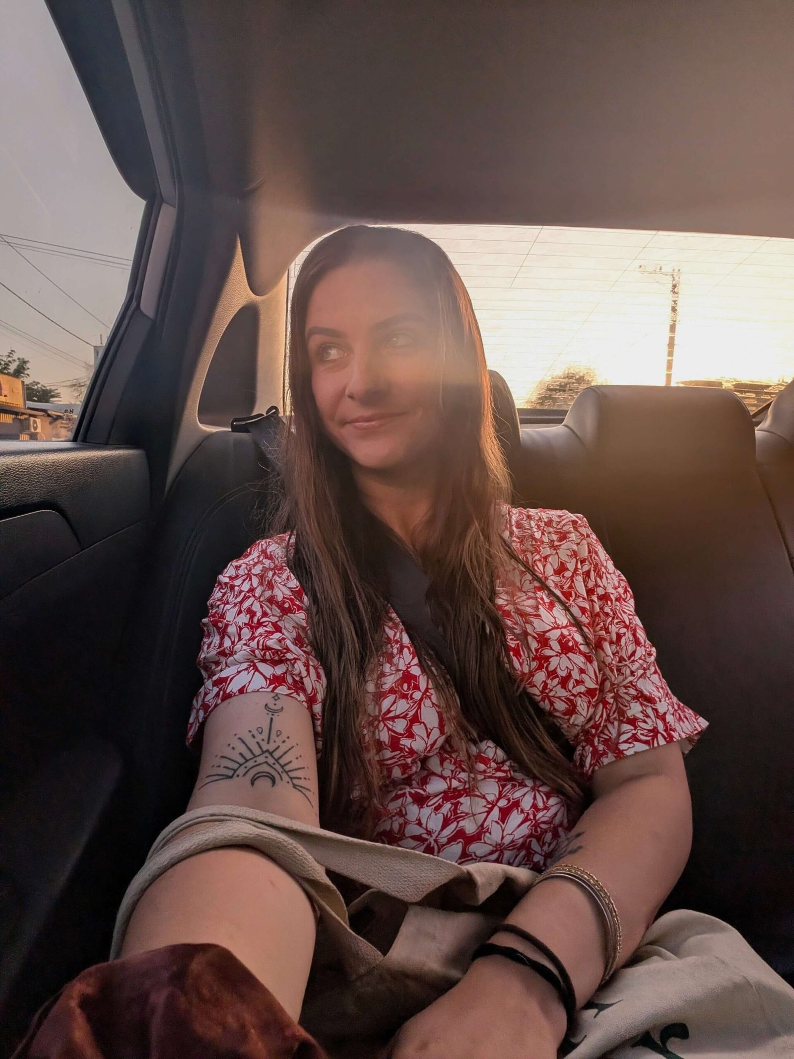 dani taking a selfie in a car